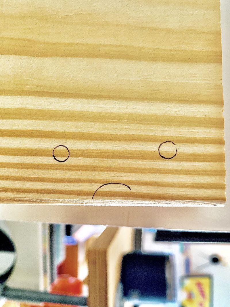 A robot with a 2x4 soul, visibly dissatisfied with its output.