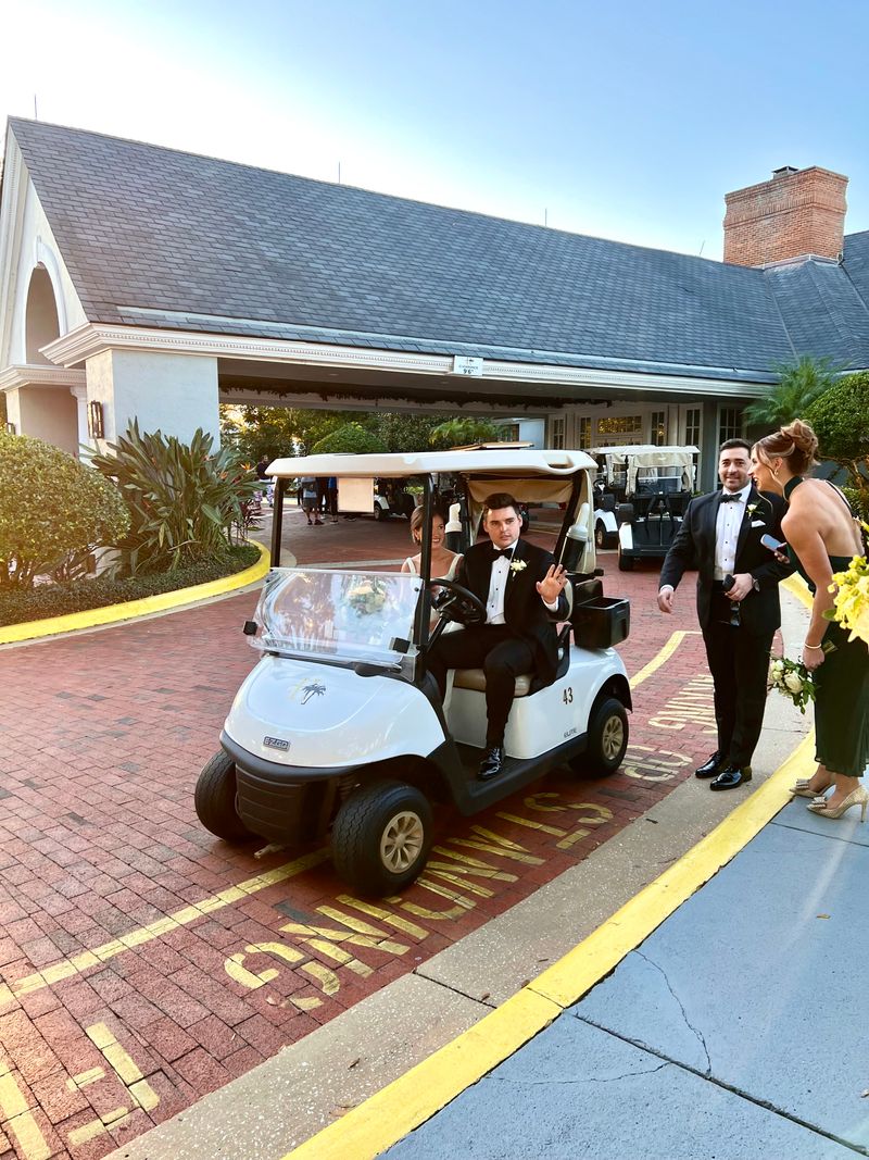 Robbie and Matt struggling to start a golf cart.
