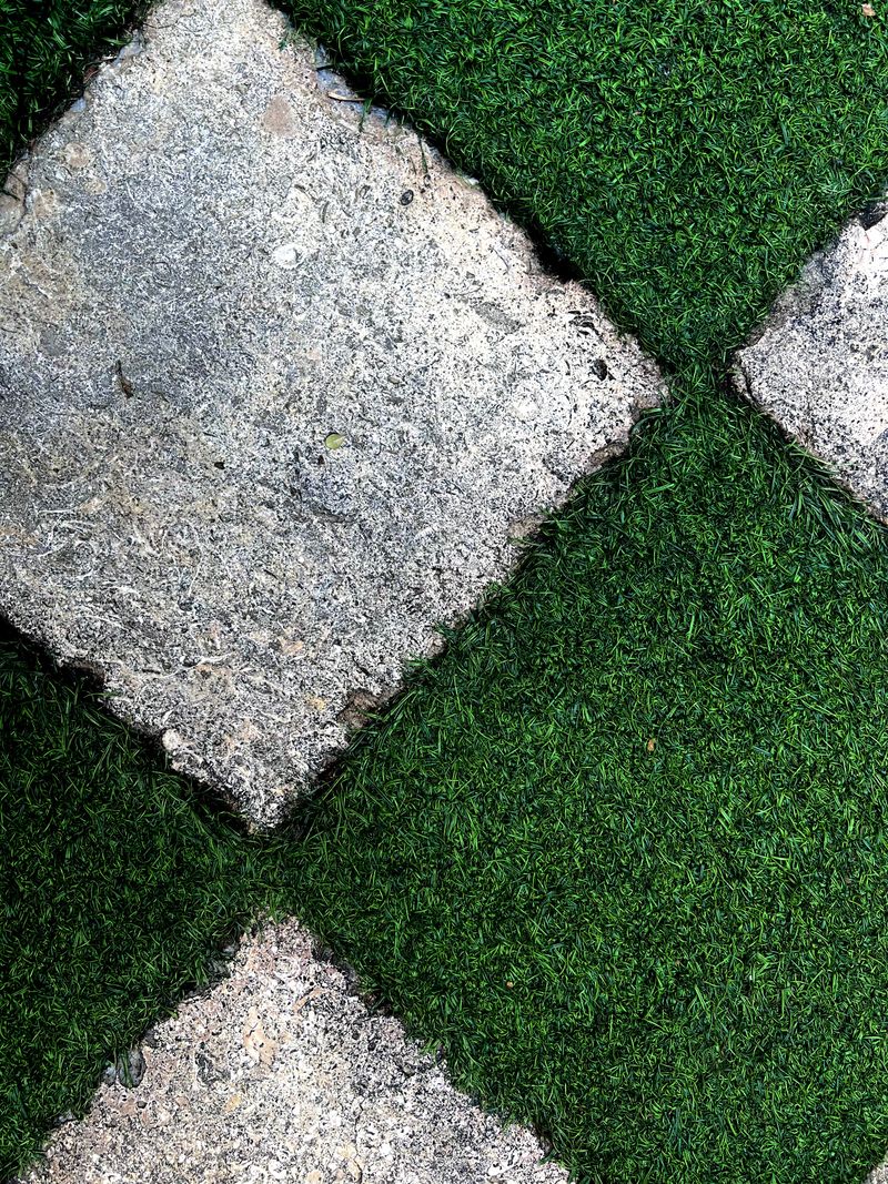 A grass and stone checkerboard.