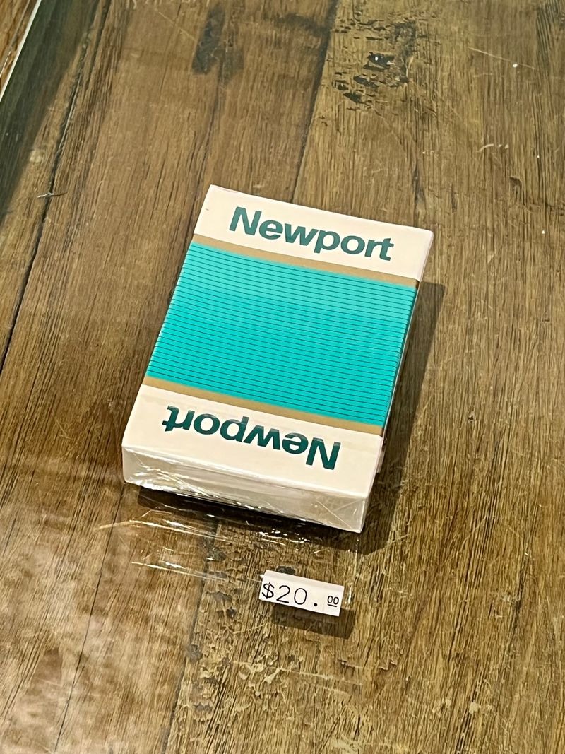 A pack of Newport cigarettes being sold for $20 in a boutique.