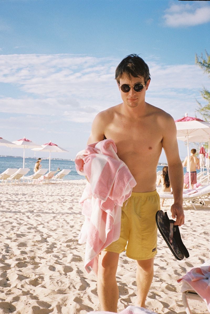 Me carrying a towel on the beach.